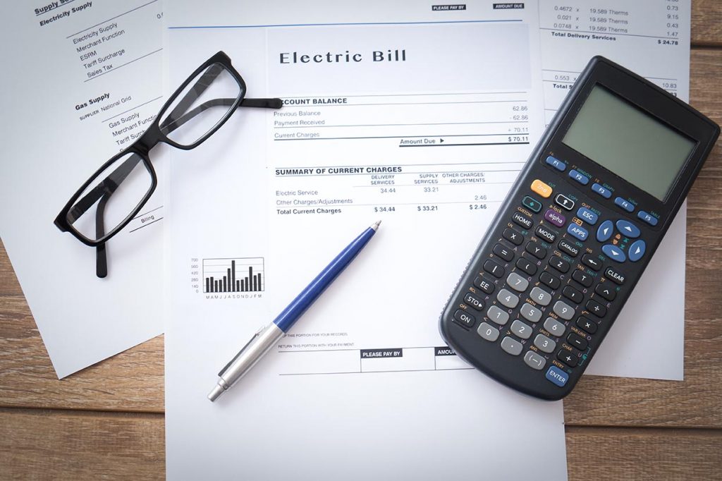 View of utility bills and calculator